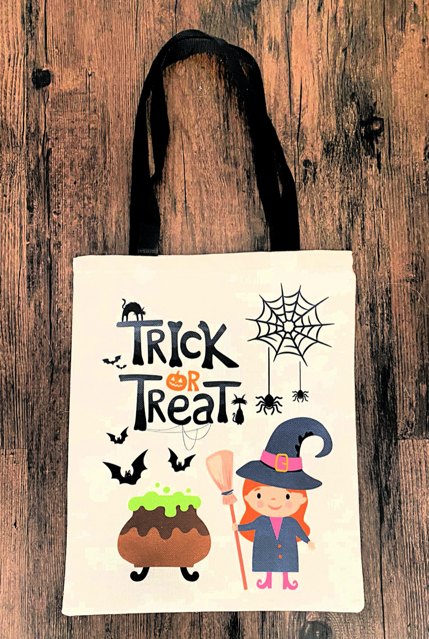 trick or treat canvas bag with black handle with little witch cauldron and spider web on front