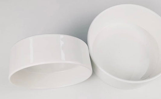 ceramic round pet bowls on white background