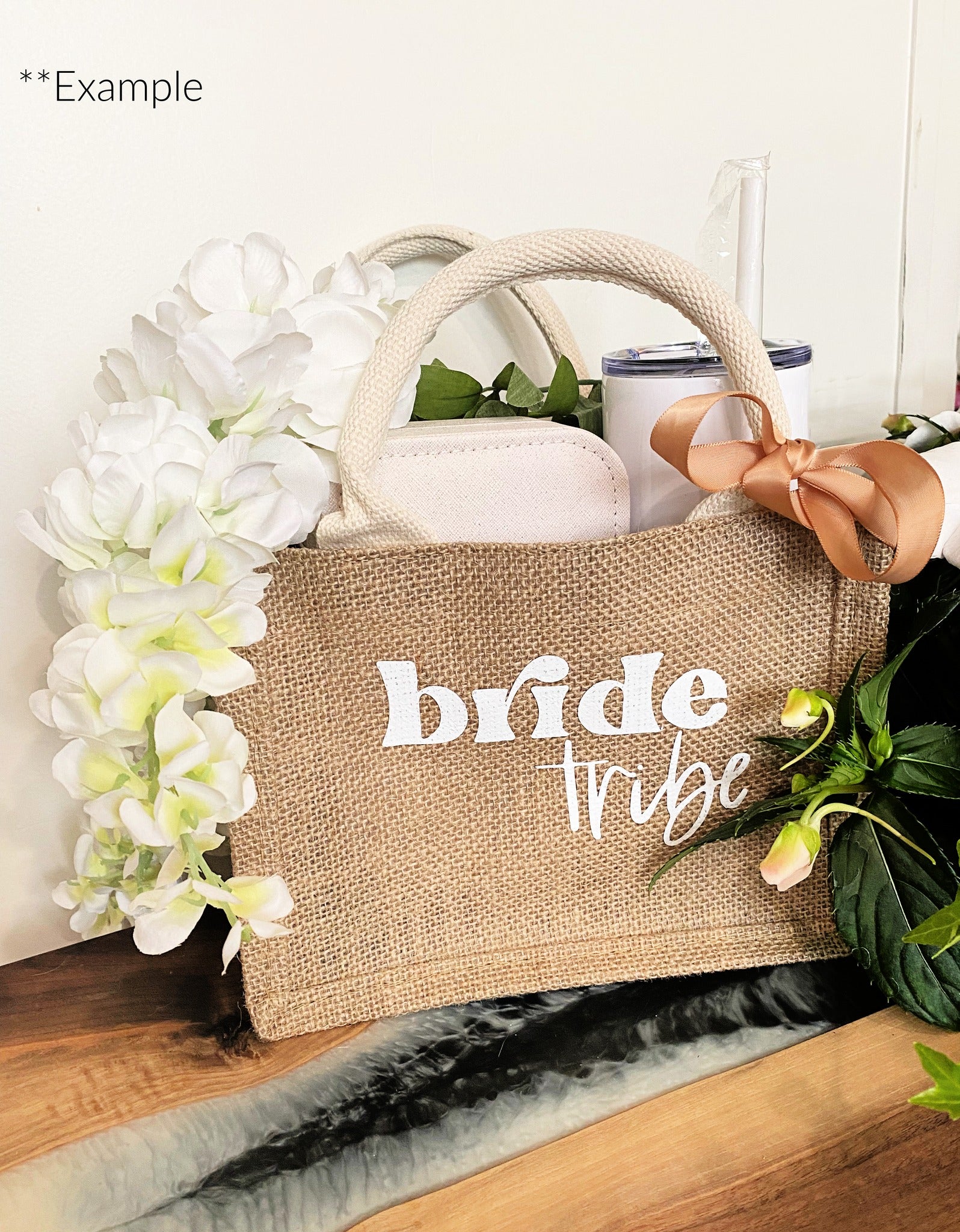 bride gift jute bag with handle and bow . with tumbler and jewellery case inside by white flowers