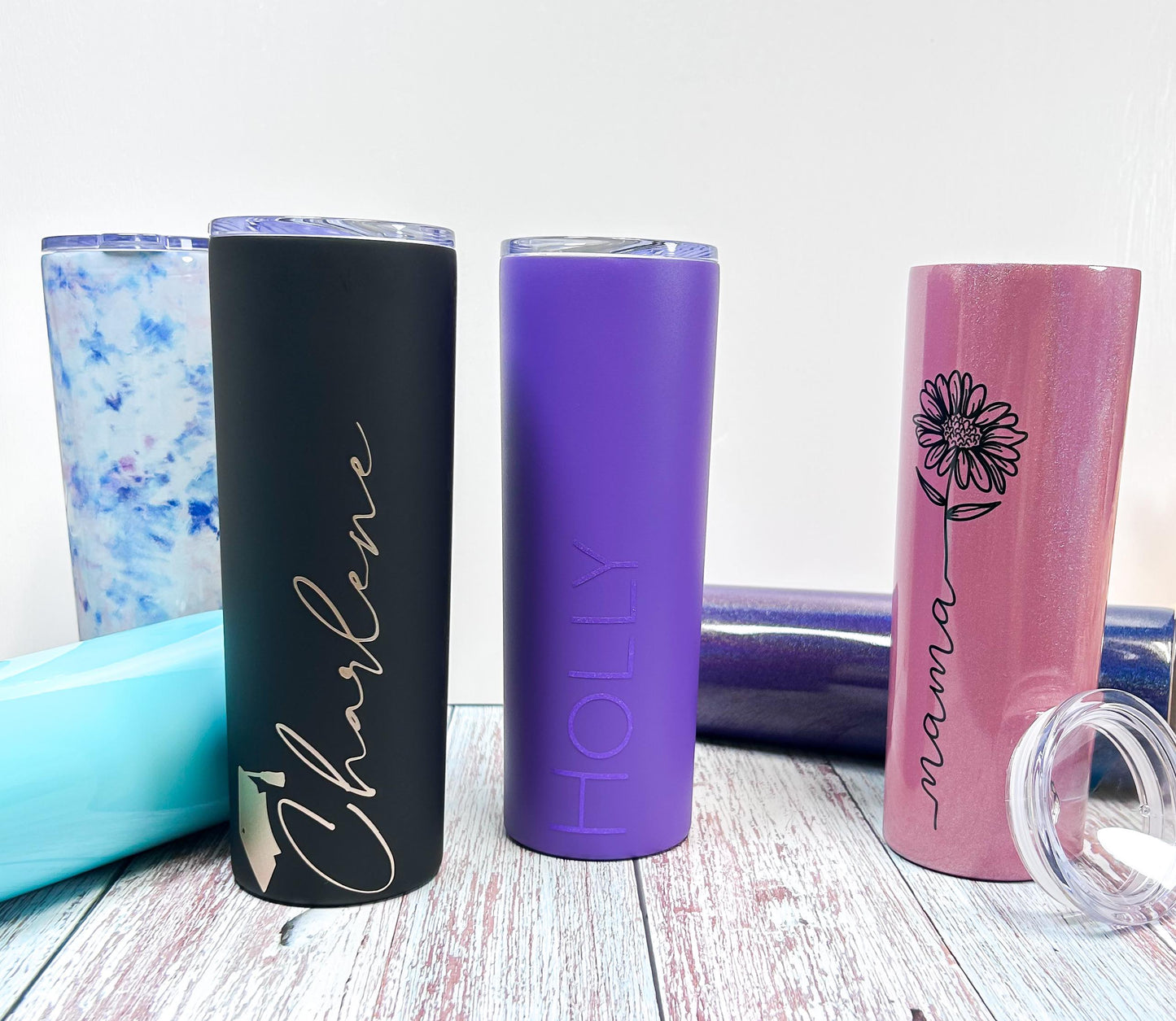 stainless steel 20oz skinny tumblers tie dye purple pink glitter with graduation cap on wood with white background