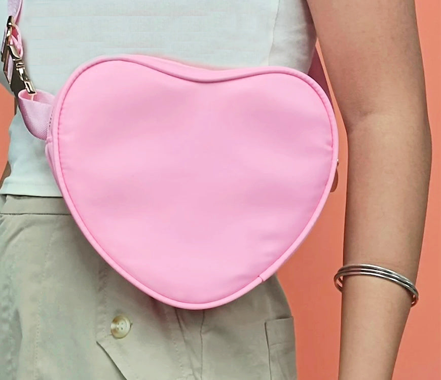 heart bag in pink on white shirt and caki pants