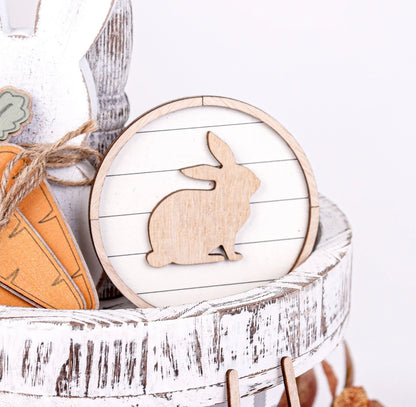 circle wooden bunny on white tier tray