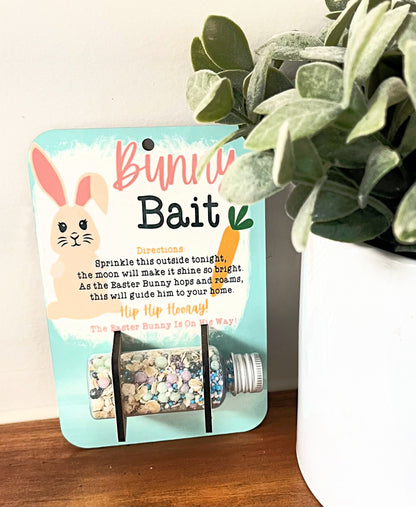 bunny bait food holder with sprinkles and oatmeal in bottle on wood desk by plant