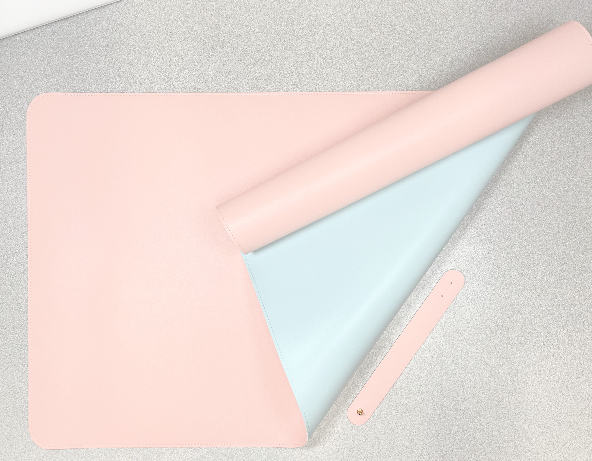 double sided desk mat pink and blue on grey background