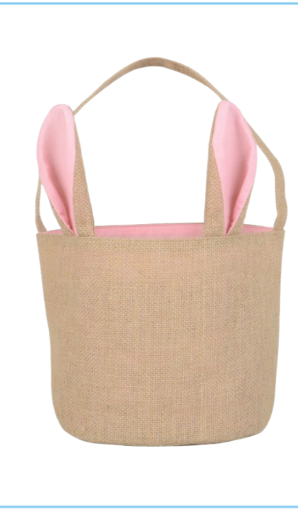 Pink  jute Easter basket with pink ears and handle on white background