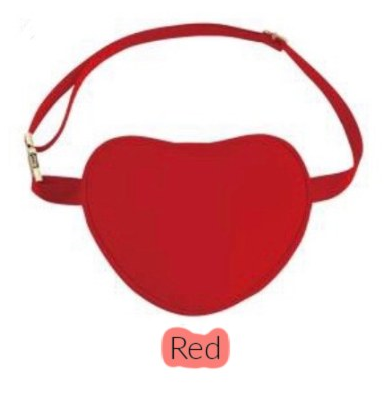 red heart shaped belt bag with gold buckle on white background