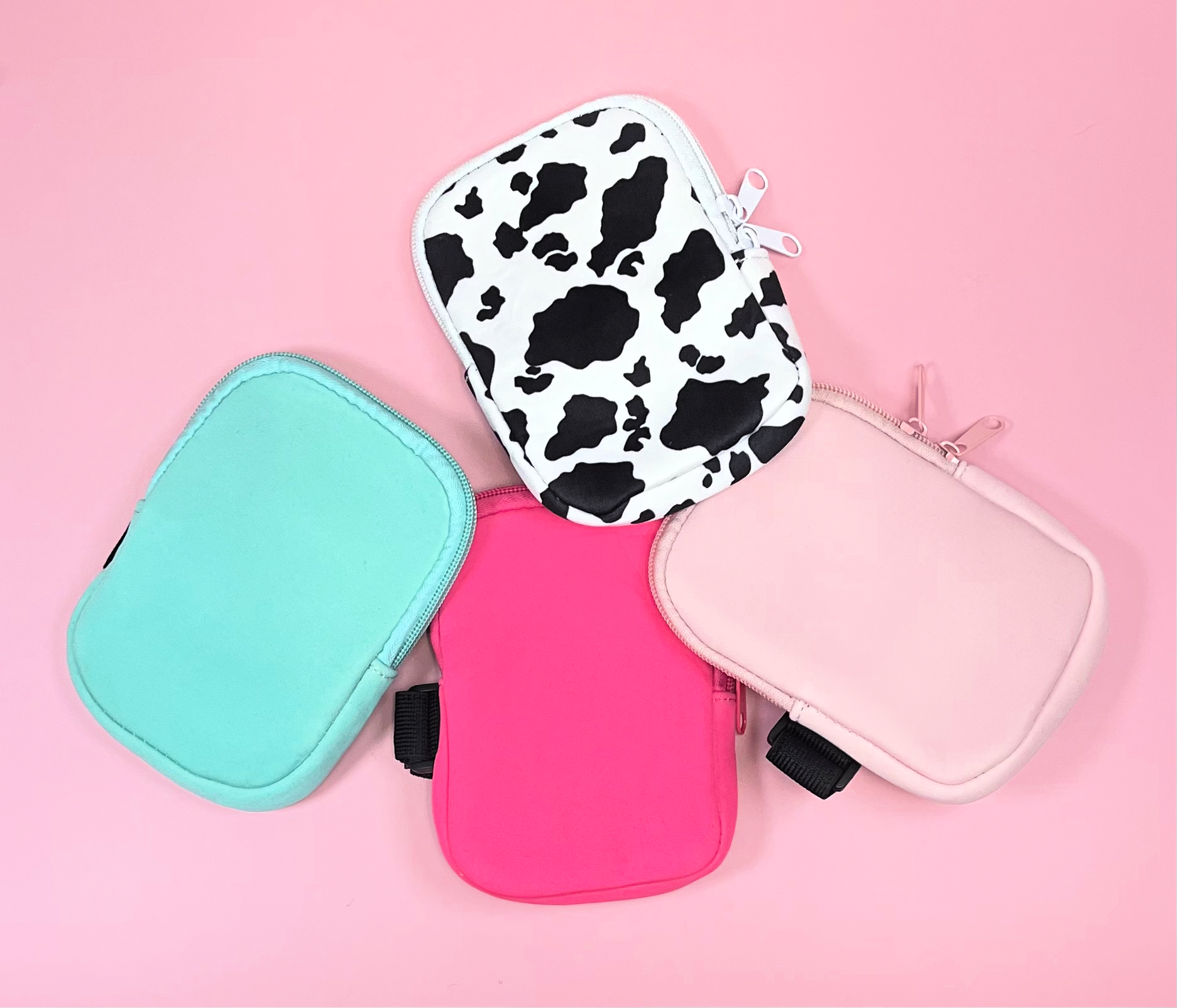 tumbler water bottle pouches with velcro cow print mint pink and blush on pink background