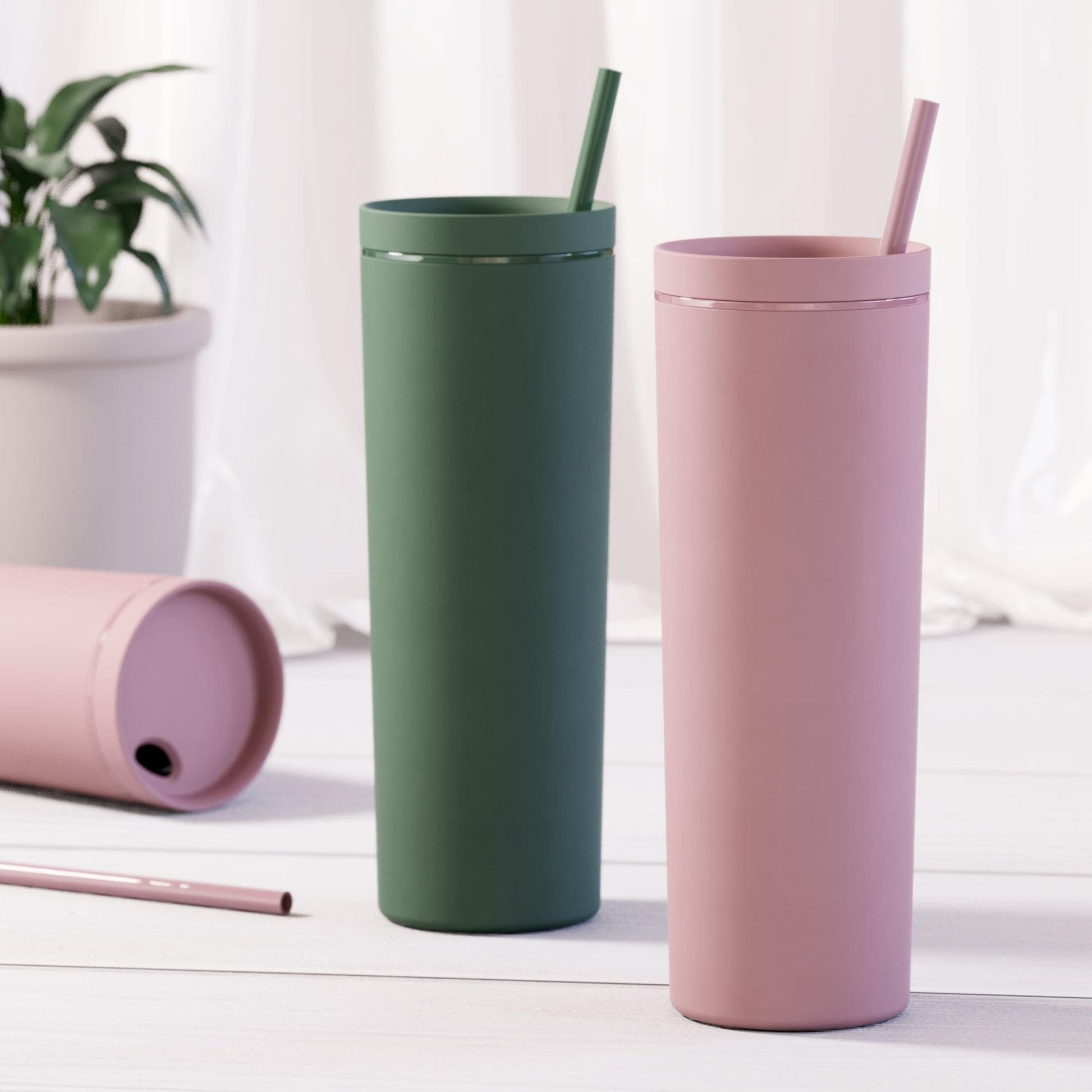 180z rubber acrylic tumblers double walled pink and pine with straw on white background with plant