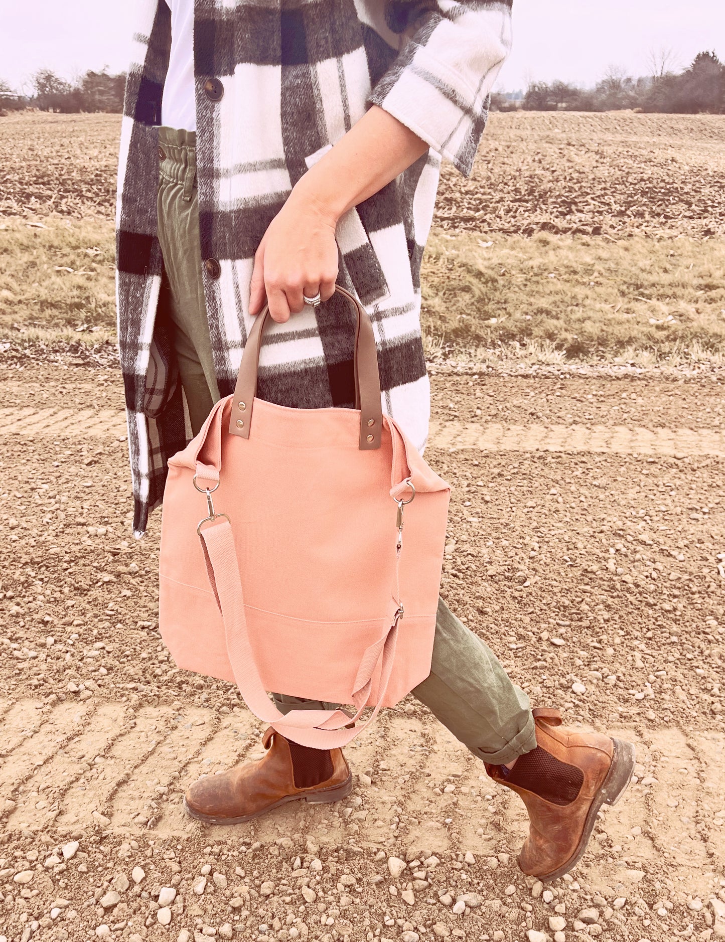 canvas pink bag with leather handle pink strap brown boots checkered sweater dirt road