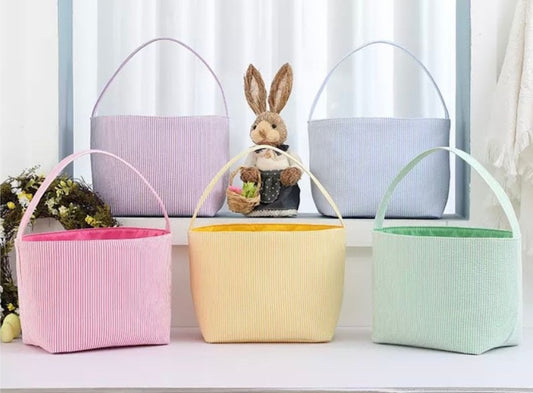 seer sucker Easter baskets in two rows with rabbit .purple blue pink yellow green