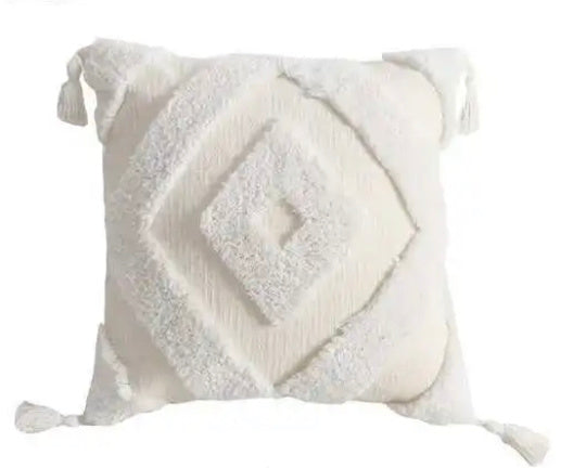 accent pillow in white with tassels and triangle  fuzzy raised pattern on white background