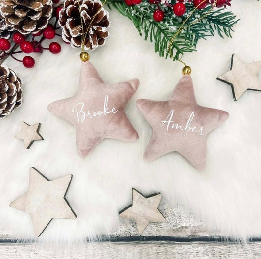 rose velvet stars personalized on white fur with Christmas pinecones and holly