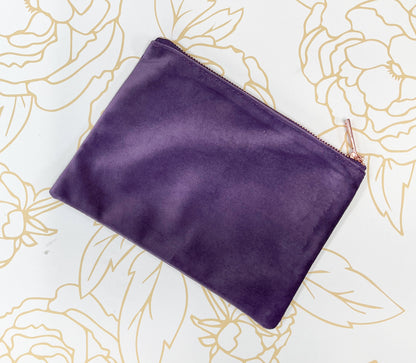 purple velvet make up case with rose gold zipper on gold flower background